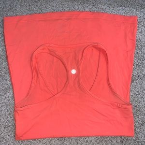 Bright peach colored lululemon tank top